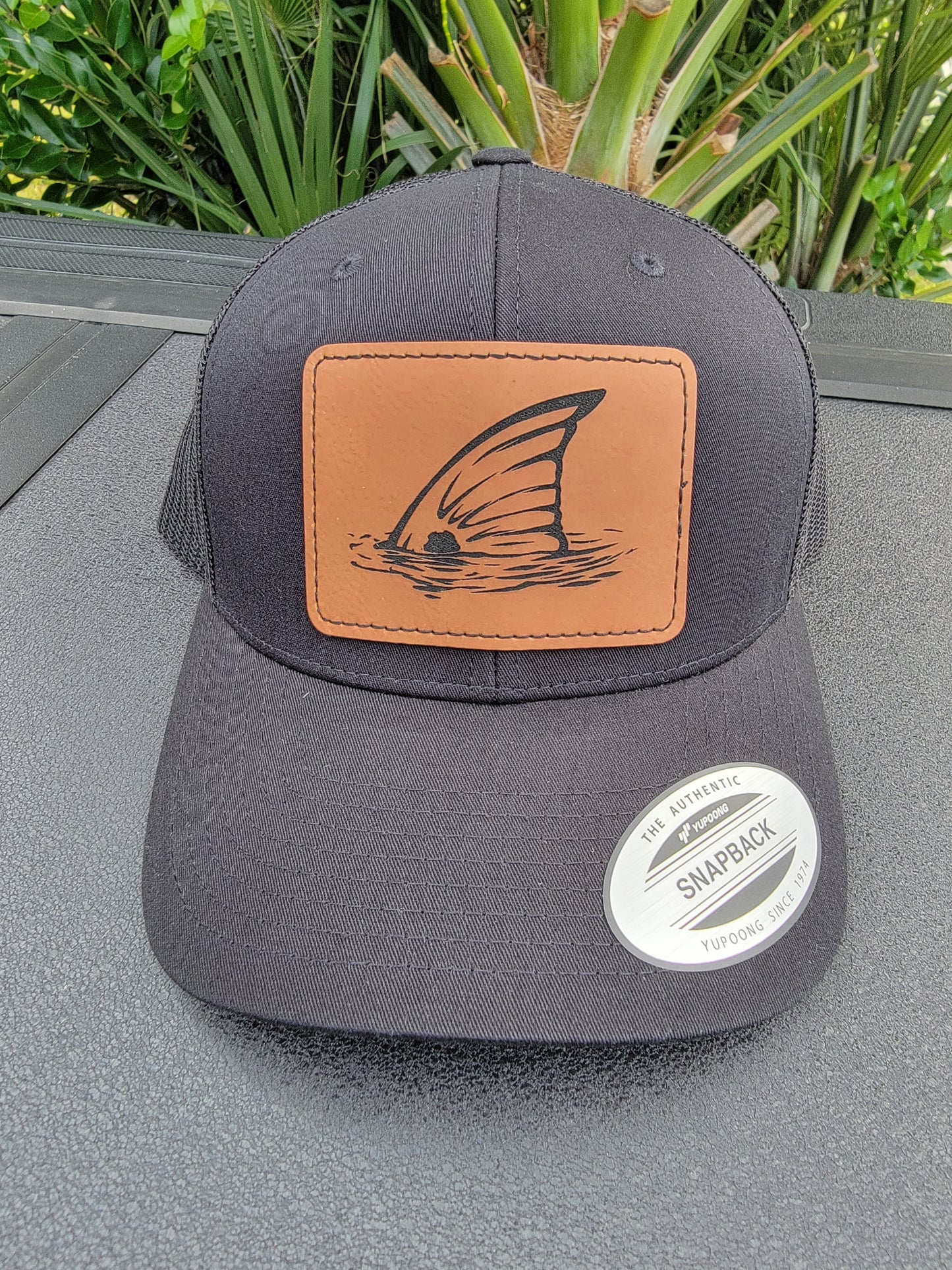 Laser Engraved Tailing Redfish Patch Trucker Hat