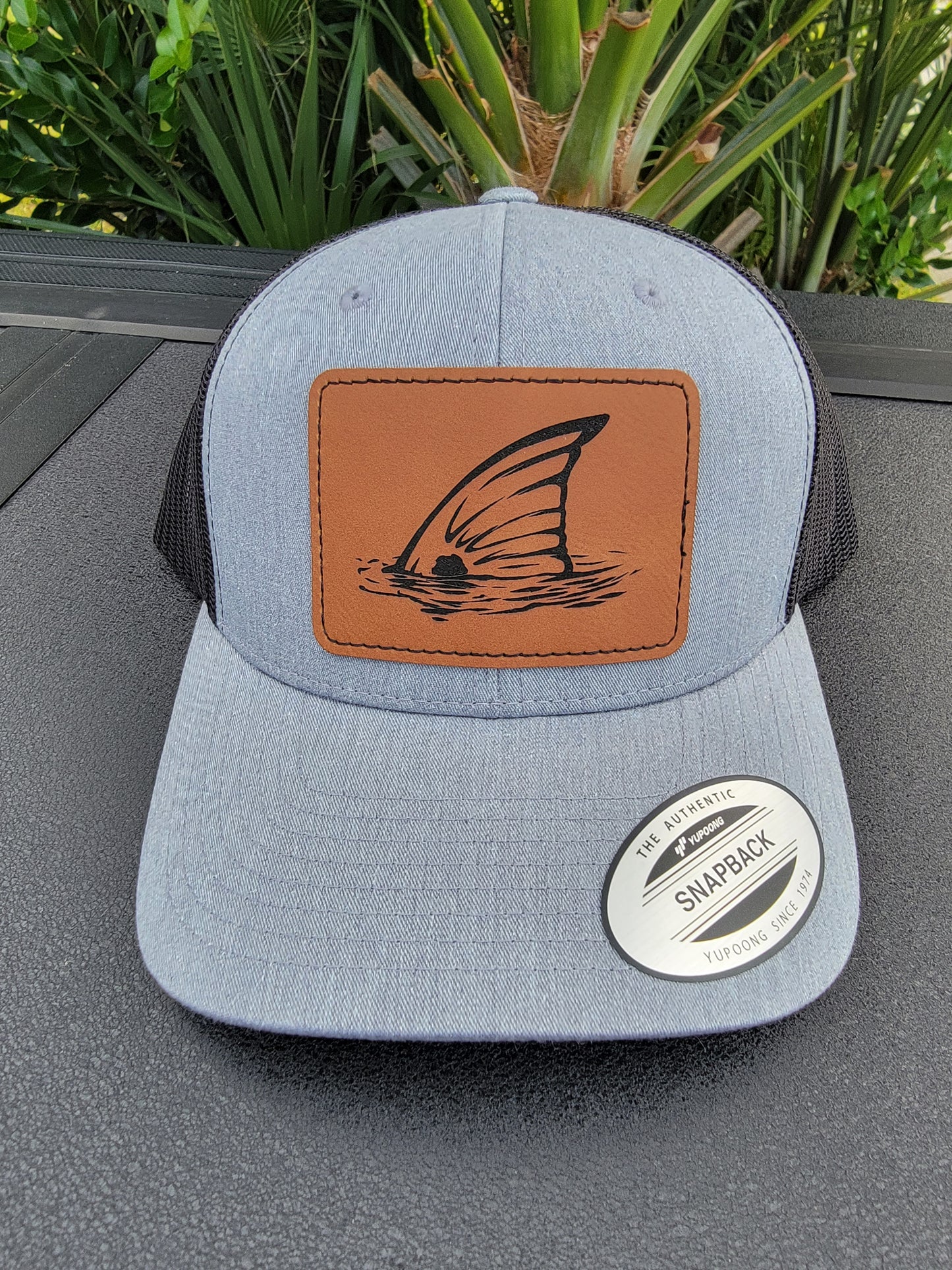 Laser Engraved Tailing Redfish Patch Trucker Hat